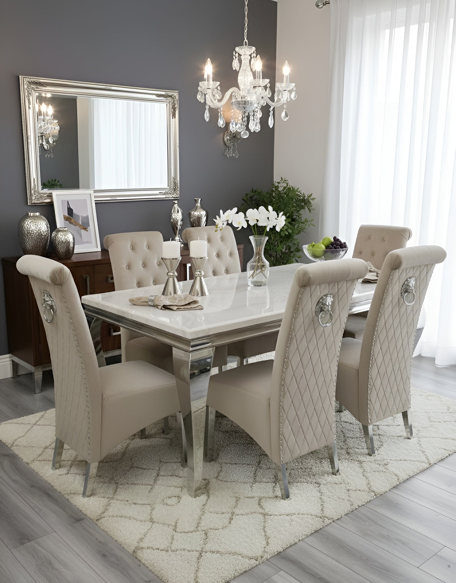 Louis white marble dining table with Sofia mink velvet chairs and lion knocker detail